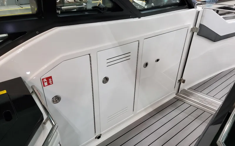 Slide: The Image of 2025 Formula 400 Super Sport Crossover boat interior with sleek white cabinetry and modern design. - 37
