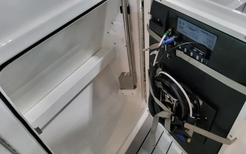 Slide: The Image of 2025 Formula 400 Super Sport Crossover interior compartment with wiring and equipment. - 38