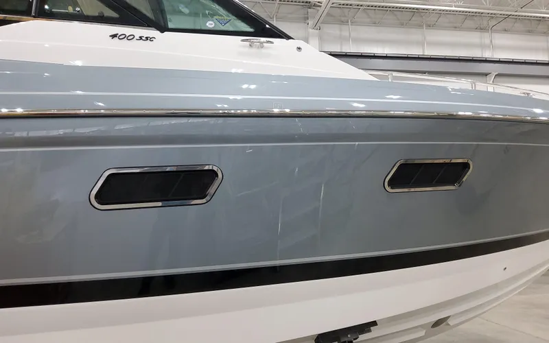 Slide: The Image of 2025 Formula 400 Super Sport Crossover boat, sleek design with modern windows. - 4