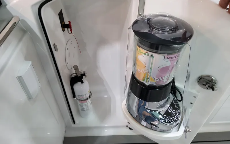 Slide: The Image of Blender and fire extinguisher in 2025 Formula 400 Super Sport Crossover boat interior. - 40