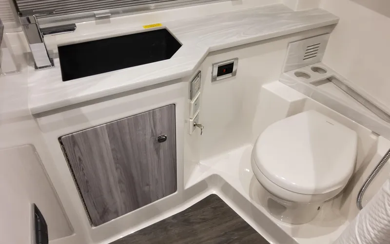 Slide: The Image of 2025 Formula 400 Super Sport Crossover bathroom with modern sink and toilet design. - 42