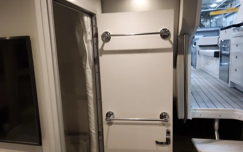 Slide: The Image of Interior view of 2025 Formula 400 Super Sport Crossover, featuring a sleek door and modern design. - 46