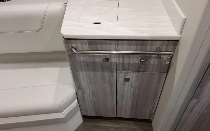 Slide: The Image of 2025 Formula 400 Super Sport Crossover interior with sleek cabinetry and seating. - 49