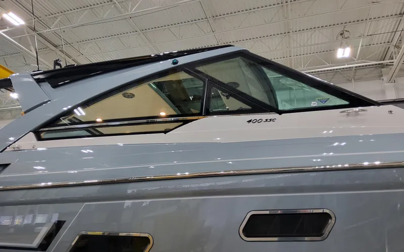 Slide: The Image of 2025 Formula 400 Super Sport Crossover yacht, sleek design, indoor showroom. - 5