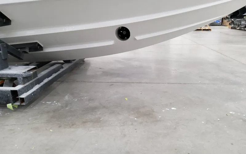 Slide: The Image of 2025 Formula 400 Super Sport Crossover boat hull in a workshop setting. - 6