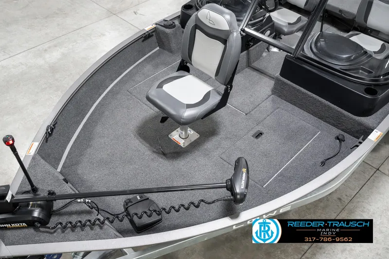 Slide: The Image of 2023 Lowe FM 1775 boat interior with seating and trolling motor. - 10