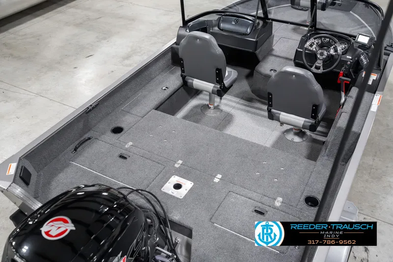 Slide: The Image of 2023 Lowe FM 1775 fishing boat interior with dual seats and steering console. - 12