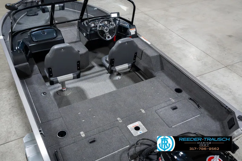 Slide: The Image of 2023 Lowe FM 1775 boat interior with dual seats and steering console. - 13