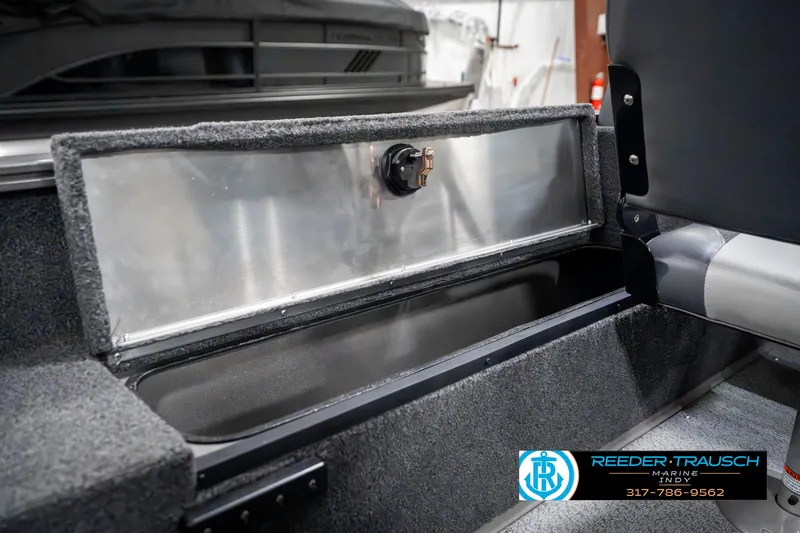 Slide: The Image of Open storage compartment in 2023 Lowe FM 1775 boat interior. - 28