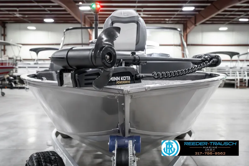 Slide: The Image of 2023 Lowe FM 1775 boat with Minn Kota motor in showroom. - 3