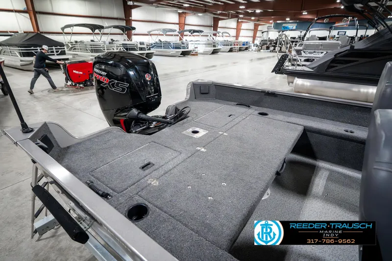 Slide: The Image of 2023 Lowe FM 1775 boat interior with Mercury engine in showroom. - 30