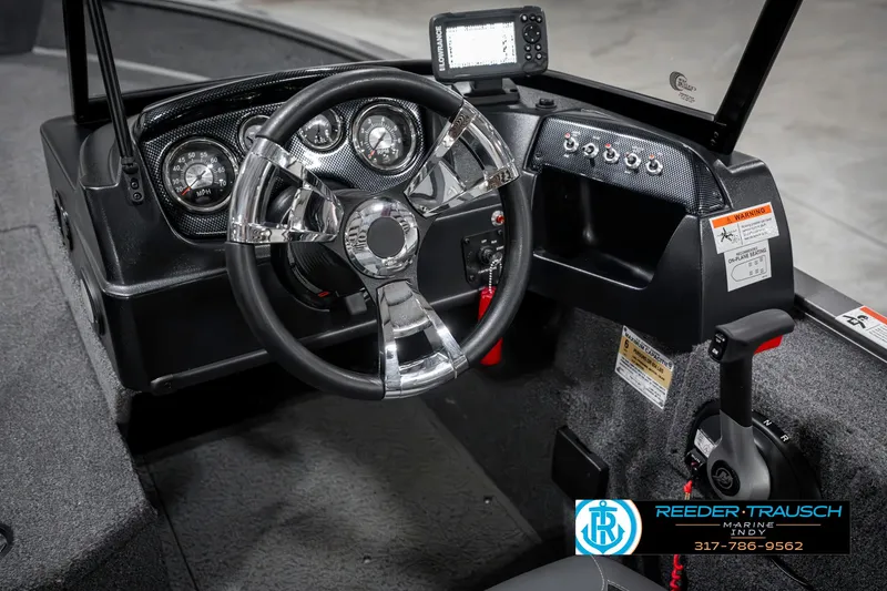 Slide: The Image of 2023 Lowe FM 1775 boat dashboard with steering wheel and control panel. - 35