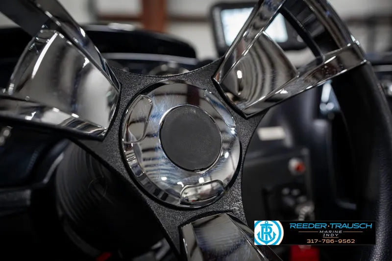 Slide: The Image of Close-up of 2023 Lowe FM 1775 steering wheel in a boat interior. - 36