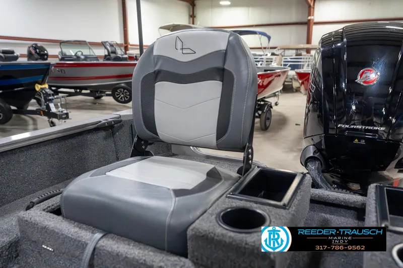 Slide: The Image of 2023 Lowe FM 1775 boat seat with cup holders in showroom. - 42