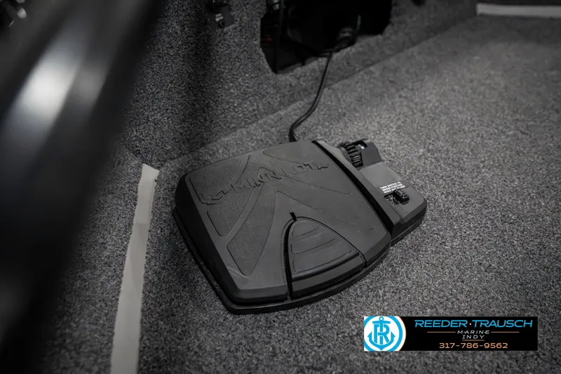 Slide: The Image of Foot pedal control in 2023 Lowe FM 1775 boat interior, Reeder-Trausch branding visible. - 47