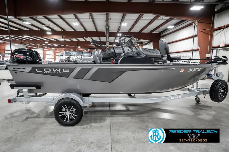 Slide: The Image of 2023 Lowe FM 1775 fishing boat on trailer in indoor showroom. - 5