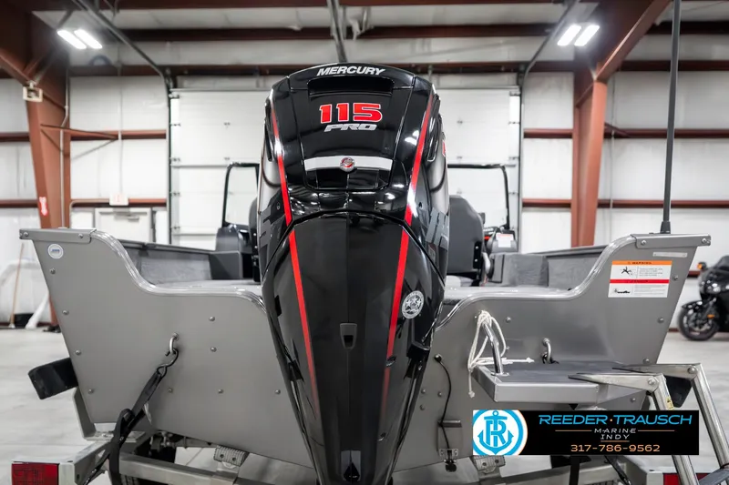 Slide: The Image of 2023 Lowe FM 1775 boat with Mercury 115 Pro XS engine in a warehouse. - 7