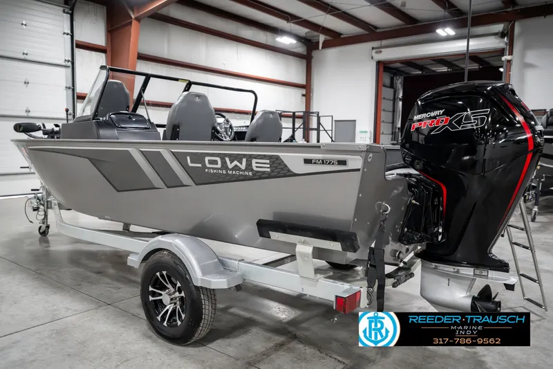 Slide: The Image of 2023 Lowe FM 1775 fishing boat in showroom, featuring Mercury Pro XS engine. - 8