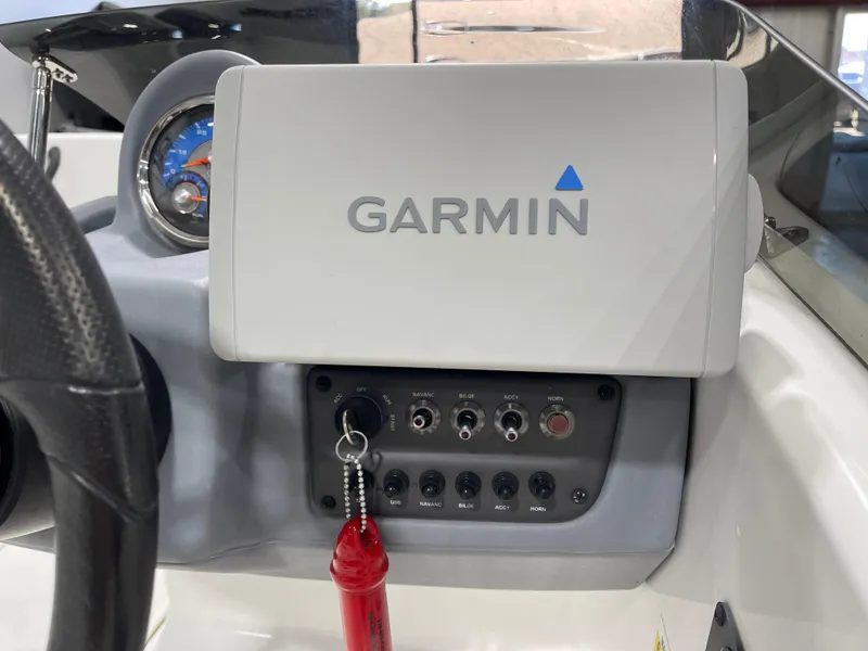 Slide: The Image of Dashboard of 2020 Tahoe T16 with Garmin navigation system and control panel. - 17