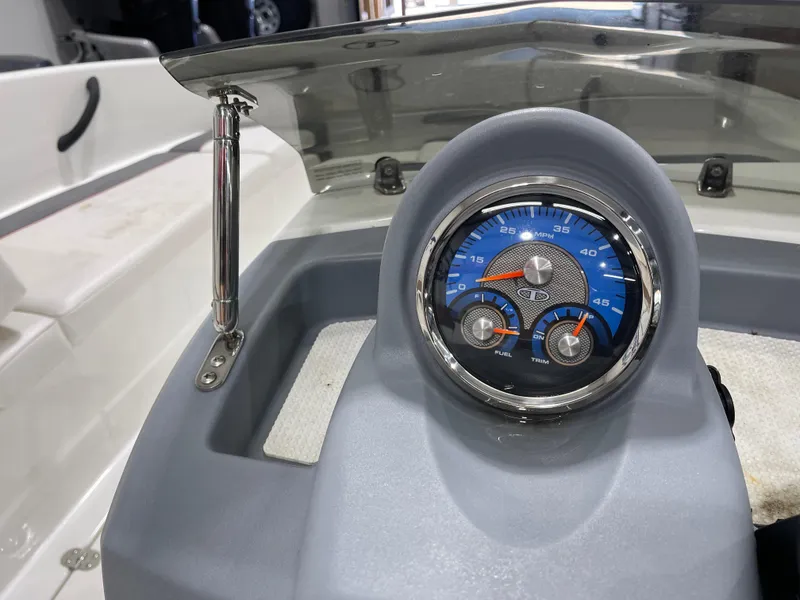 Slide: The Image of Dashboard of a 2020 Tahoe T16 boat with speedometer and gauges. - 18