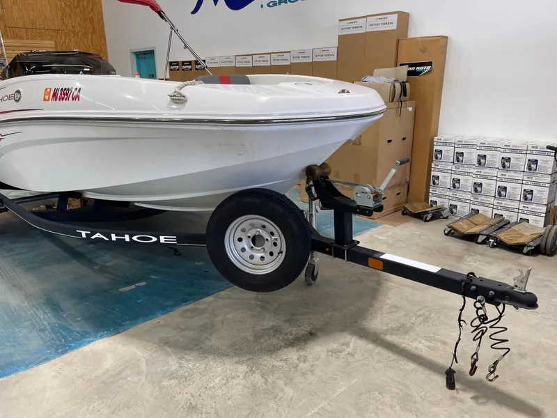Slide: The Image of 2020 Tahoe T16 boat on trailer in indoor storage facility. - 5