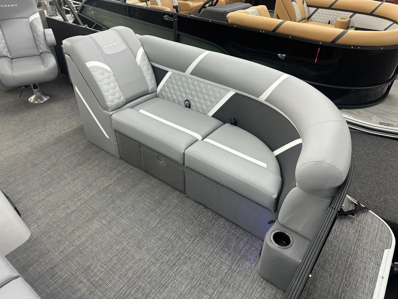 Slide: The Image of 2025 Crest Classic 220 boat interior with gray seating and modern design. - 3