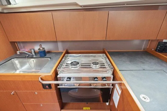 Slide: The Image of Modern kitchen in 2018 Beneteau Oceanis 41.1 yacht with stove and sink. - 11