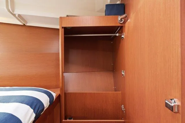 Slide: The Image of Wooden closet interior on 2018 Beneteau Oceanis 41.1 yacht, featuring open storage space. - 20