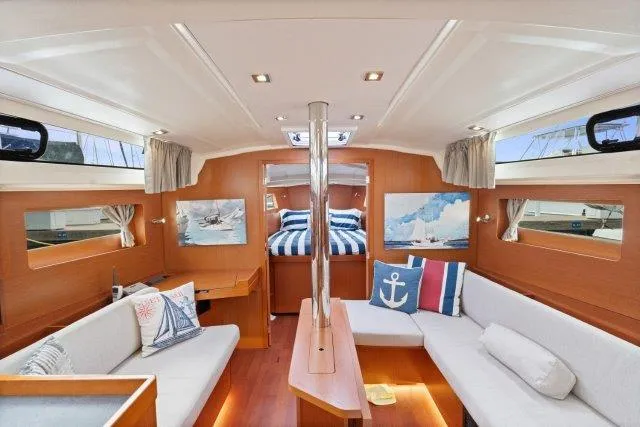 Slide: The Image of Interior of 2018 Beneteau Oceanis 41.1 yacht with cozy seating and nautical decor. - 3