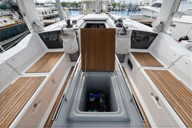 Slide: The Image of 2018 Beneteau Oceanis 41.1 yacht cockpit with open storage compartment, docked at marina. - 32