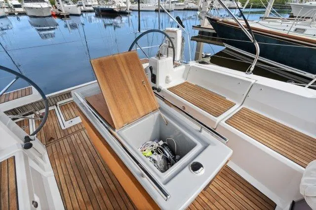 Slide: The Image of Cockpit of 2018 Beneteau Oceanis 41.1 sailboat with open storage compartment. - 33