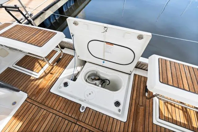 Slide: The Image of Beneteau Oceanis 41.1 (2018) yacht deck with open storage compartment. - 38