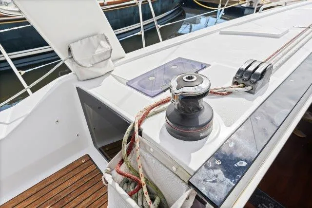 Slide: The Image of 2018 Beneteau Oceanis 41.1 yacht deck with winch and ropes. - 44