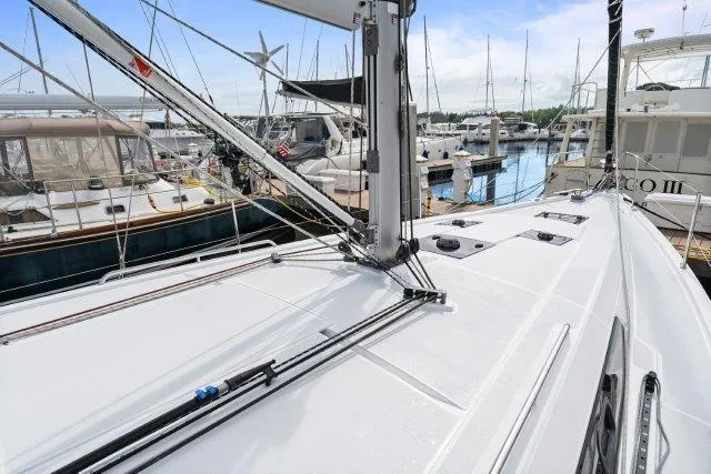 Slide: The Image of 2018 Beneteau Oceanis 41.1 sailboat deck in marina, showcasing sleek design and rigging. - 48