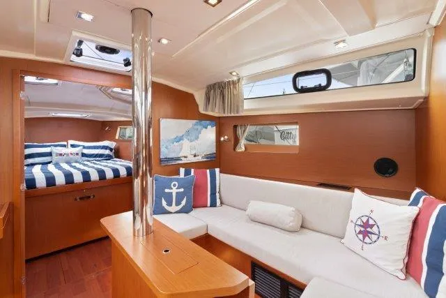 Slide: The Image of 2018 Beneteau Oceanis 41.1 yacht interior with cozy seating and nautical decor. - 6
