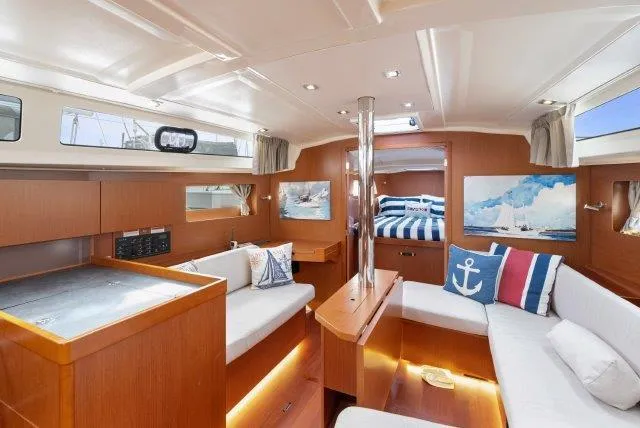 Slide: The Image of Interior of 2018 Beneteau Oceanis 41.1 yacht with modern furnishings and nautical decor. - 7