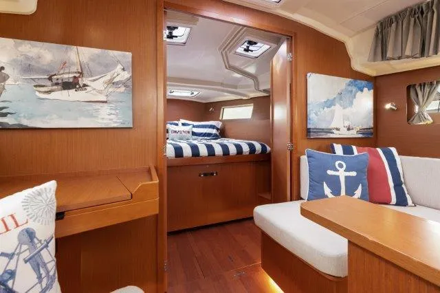 Slide: The Image of Interior of 2018 Beneteau Oceanis 41.1 yacht with nautical decor and cozy cabin. - 9