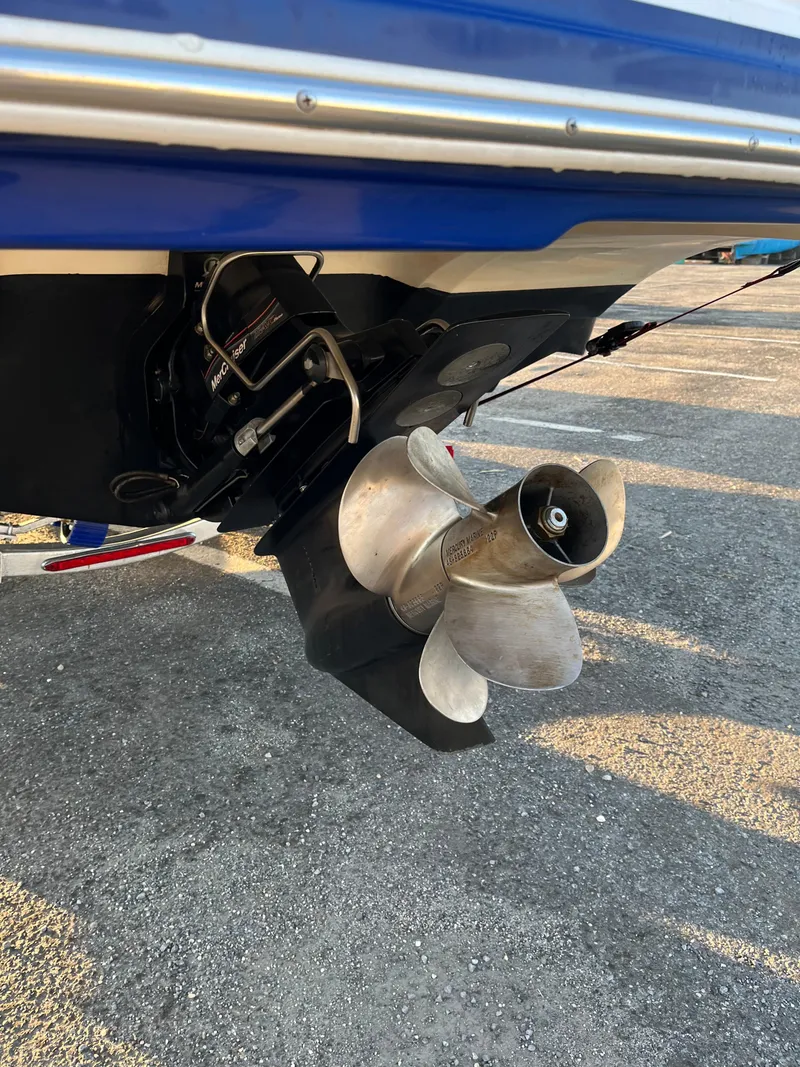 Slide: The Image of 2008 Rinker 246 Captiva Bowrider boat propeller and stern detail. - 8