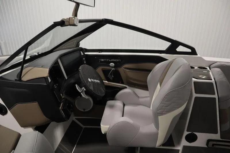 Slide: The Image of 2025 Centurion Ri245 boat interior with modern dashboard and comfortable seating. - 15