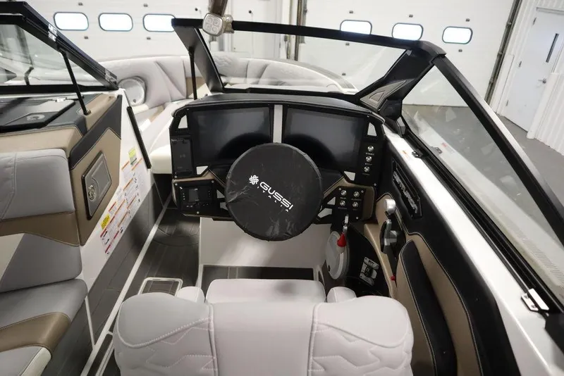 Slide: The Image of Interior view of 2025 Centurion Ri245 boat cockpit with modern steering and controls. - 16