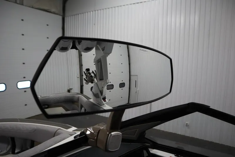 Slide: The Image of 2025 Centurion Ri245 rearview mirror reflecting interior details in a garage setting. - 17