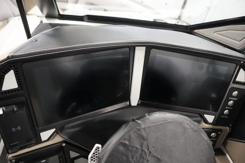 Slide: The Image of 2025 Centurion Ri245 dashboard with dual touchscreen displays and modern controls. - 21