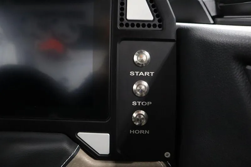 Slide: The Image of Dashboard controls of 2025 Centurion Ri245 with start, stop, and horn buttons. - 22