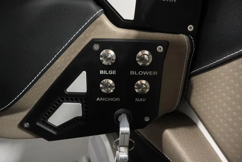 Slide: The Image of Control panel of 2025 Centurion Ri245 boat with bilge, blower, anchor, and nav switches. - 23