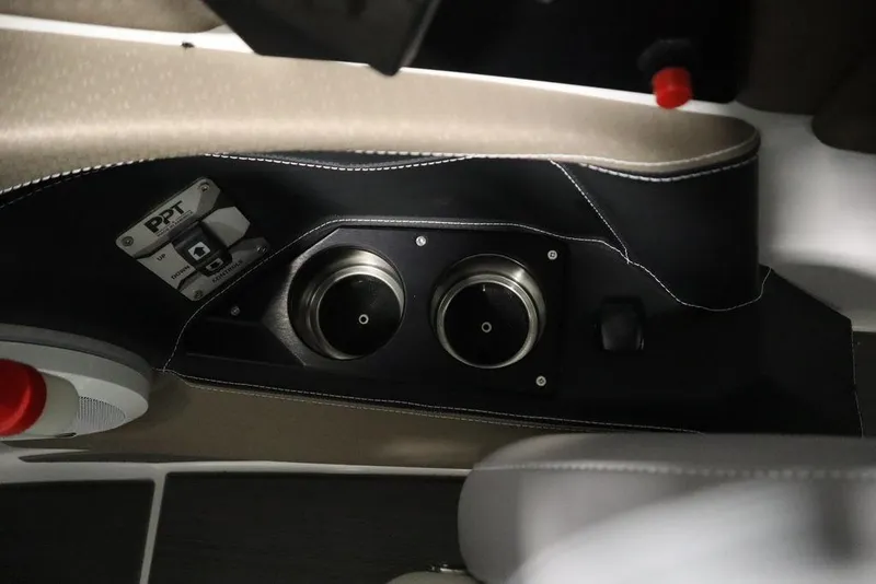 Slide: The Image of 2025 Centurion Ri245 interior detail with cup holders and control panel. - 25
