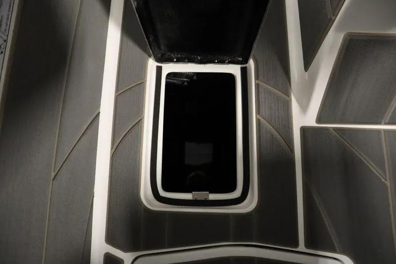 Slide: The Image of 2025 Centurion Ri245 boat storage compartment with open hatch, showcasing sleek interior design. - 29