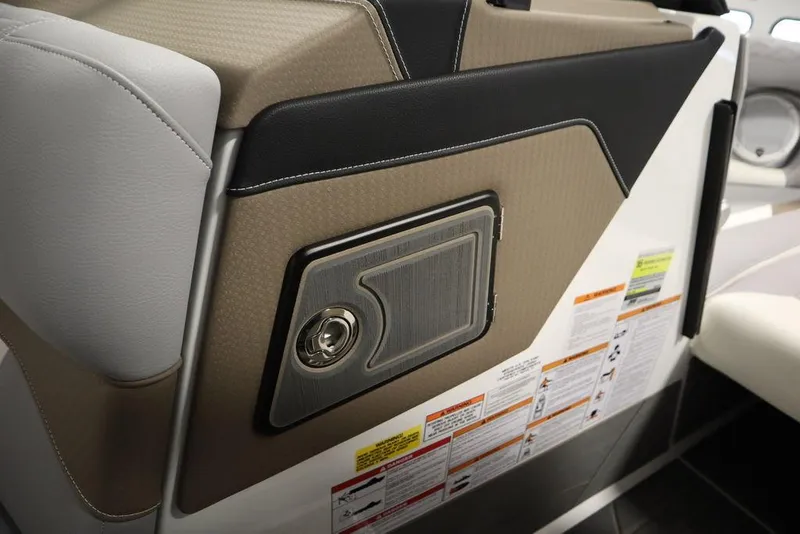 Slide: The Image of Interior detail of 2025 Centurion Ri245 boat, featuring sleek design and storage compartment. - 32