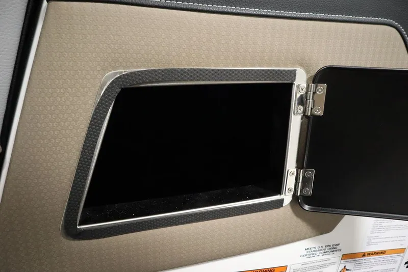 Slide: The Image of 2025 Centurion Ri245 storage compartment with open door, showcasing interior design details. - 33