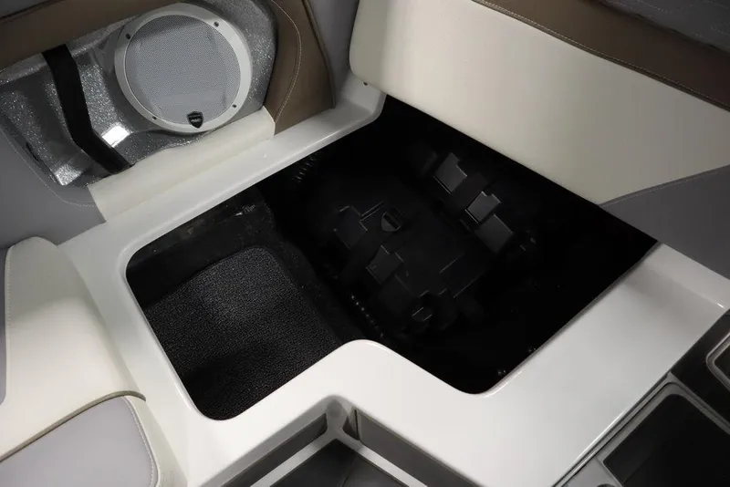 Slide: The Image of 2025 Centurion Ri245 boat interior storage compartment with speaker detail. - 40