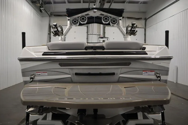 Slide: The Image of 2025 Centurion Ri245 boat rear view in a storage facility. - 7